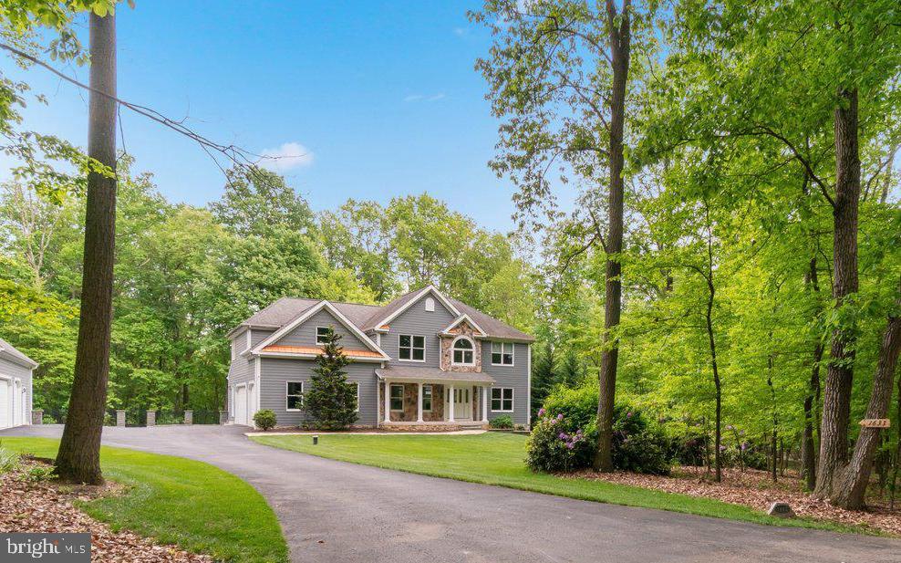 1633 Freeland Road Freeland, MD 21053 - Photo 2 of 73 a front view of a house with a garden