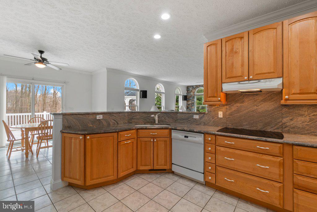 1633 Freeland Road Freeland, MD 21053 - Photo 22 of 73 a large kitchen with granite countertop a sink and a counter top space