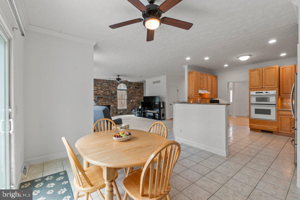 1633 Freeland Road Freeland, MD 21053 - Photo 24 of 73 a dining room with furniture and a kitchen view