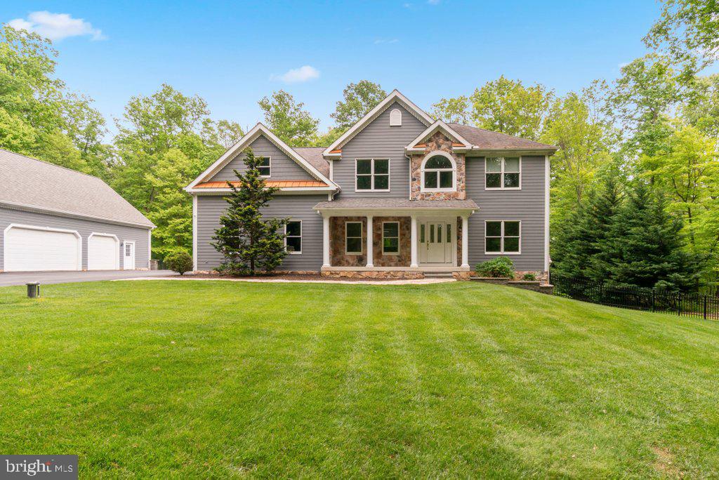 1633 Freeland Road Freeland, MD 21053 - Photo 3 of 73 a front view of a house with a garden