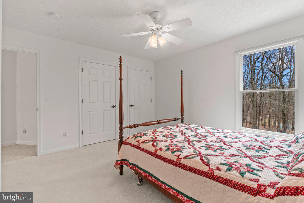 1633 Freeland Road Freeland, MD 21053 - Photo 38 of 73 a bedroom with a bed and a painting on the wall