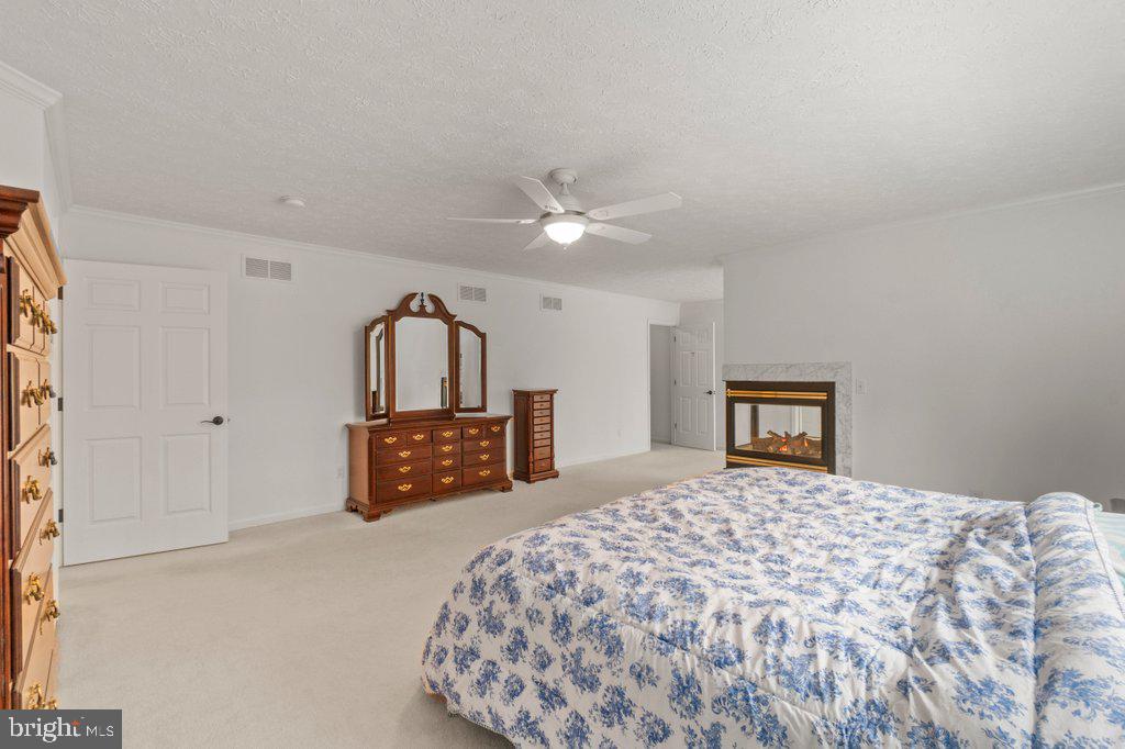 1633 Freeland Road Freeland, MD 21053 - Photo 40 of 73 a bedroom with a large bed and a dresser