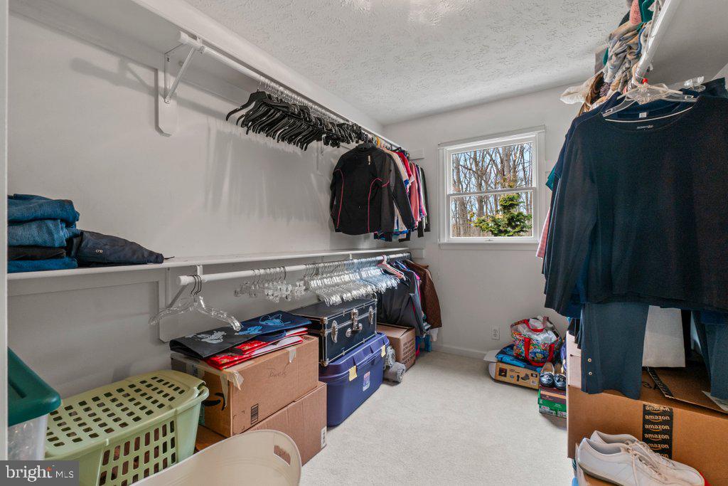 1633 Freeland Road Freeland, MD 21053 - Photo 46 of 73 a view of walk in closet with clothes and shoes