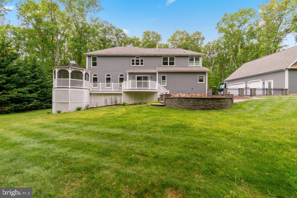 1633 Freeland Road Freeland, MD 21053 - Photo 64 of 73 a front view of a house with a garden and yard