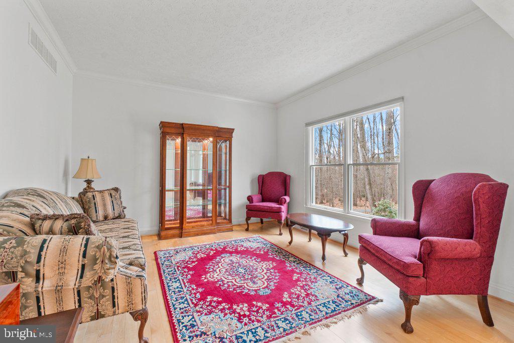 1633 Freeland Road Freeland, MD 21053 - Photo 10 of 73 a living room with furniture a rug and a window