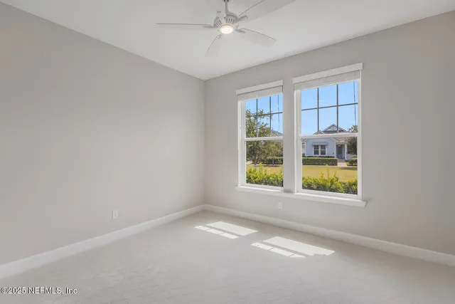 a bathroom with a toilet sink vanity and shower