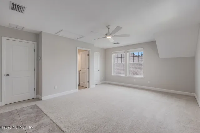 an aerial view of a house with a ocean view
