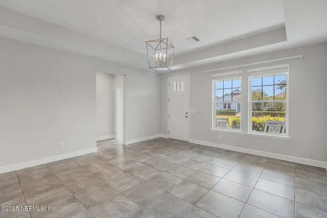 a kitchen with stainless steel appliances granite countertop a sink a stove a refrigerator and island with wooden floor