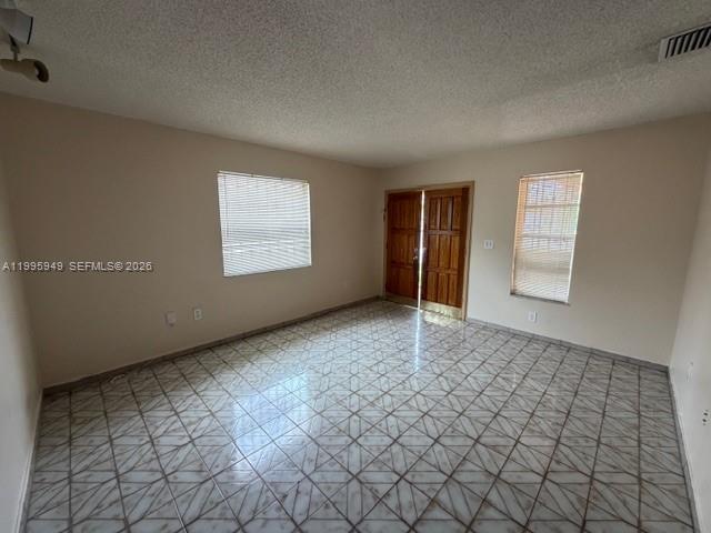 3112 Southwest 17th Street, Unit 3112 Miami, FL 33145 - Photo 3 of 12 an empty room with windows