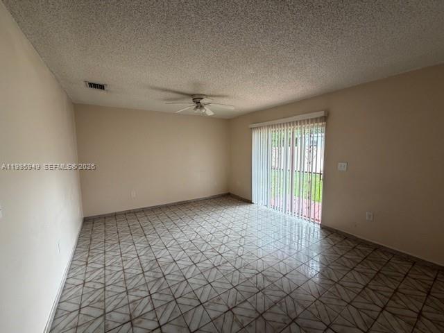 3112 Southwest 17th Street, Unit 3112 Miami, FL 33145 - Photo 4 of 12 a view of an empty room with a window