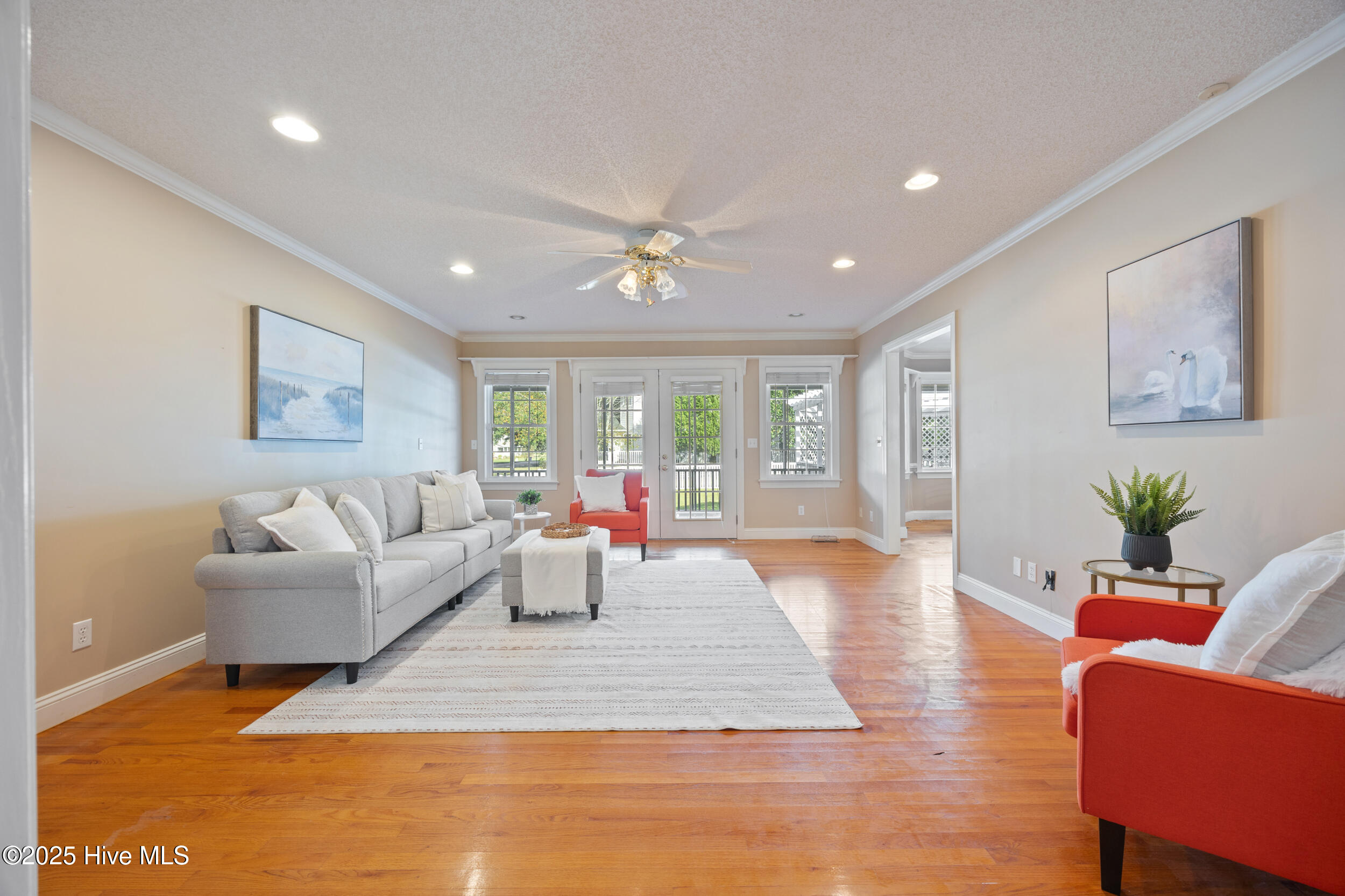 503 Robin Lane Edenton, NC 27932 - Photo 2 of 37 Bright living room with wood floors, French door leading to screened porch