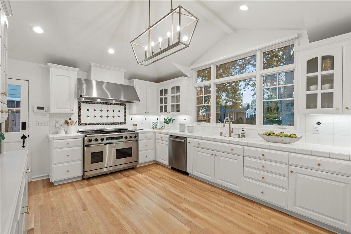 1042 Camino Ramon San Jose, CA 95125 - Photo 14 of 54 a kitchen with stainless steel appliances granite countertop a stove and cabinets
