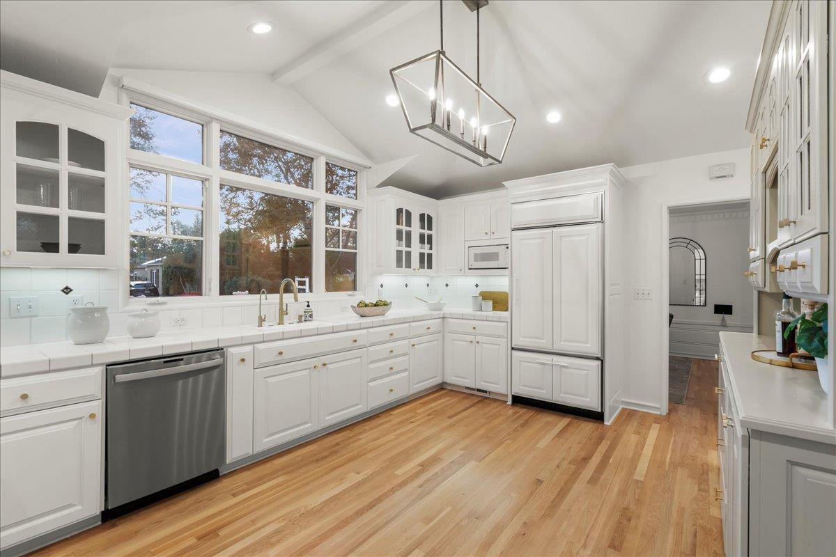1042 Camino Ramon San Jose, CA 95125 - Photo 15 of 54 a large kitchen with a wooden floor and white cabinets