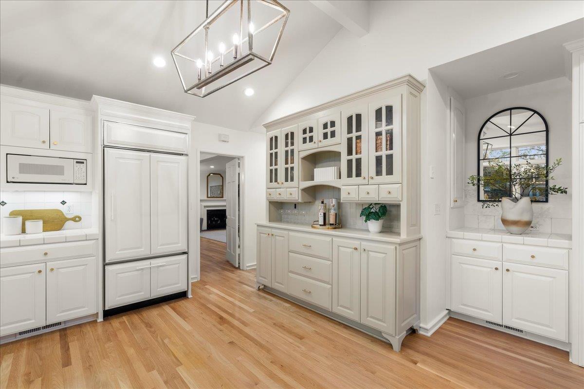 1042 Camino Ramon San Jose, CA 95125 - Photo 16 of 54 a kitchen with cabinets and wooden floor