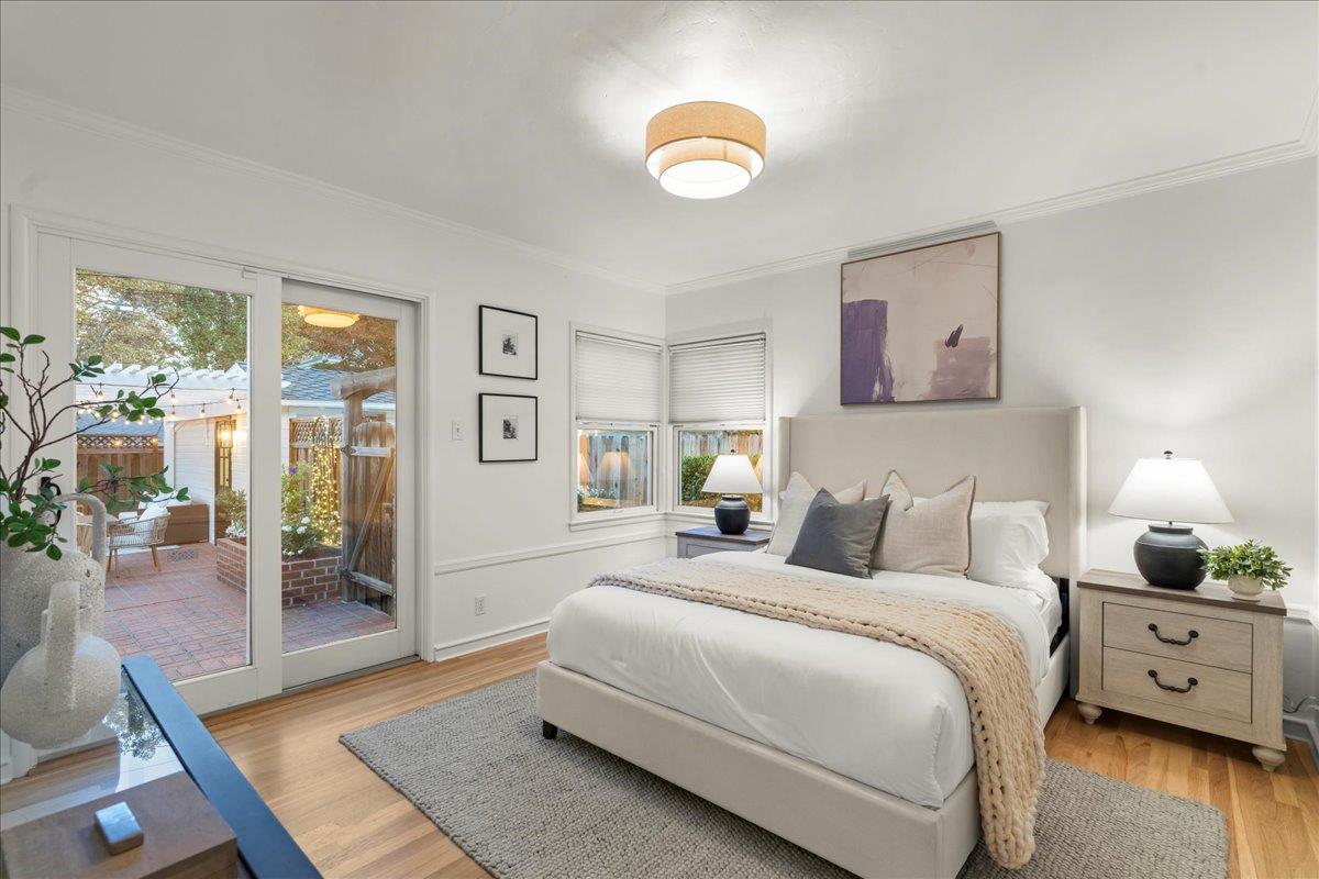 1042 Camino Ramon San Jose, CA 95125 - Photo 19 of 54 a bedroom with a large bed and a chandelier