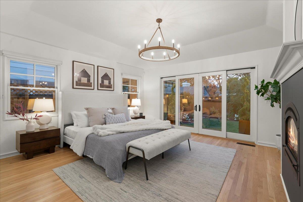 1042 Camino Ramon San Jose, CA 95125 - Photo 22 of 54 a bedroom with a large bed and a tv