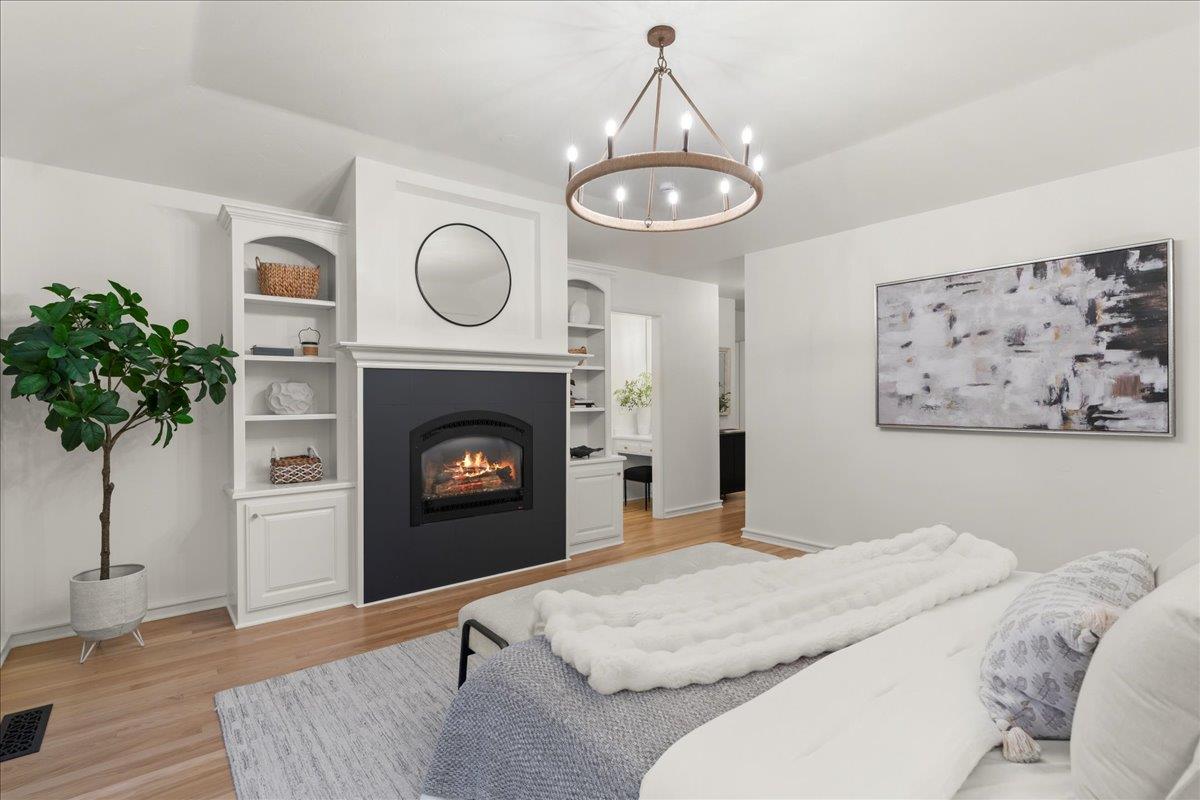 1042 Camino Ramon San Jose, CA 95125 - Photo 23 of 54 a bedroom with a bed and a fireplace