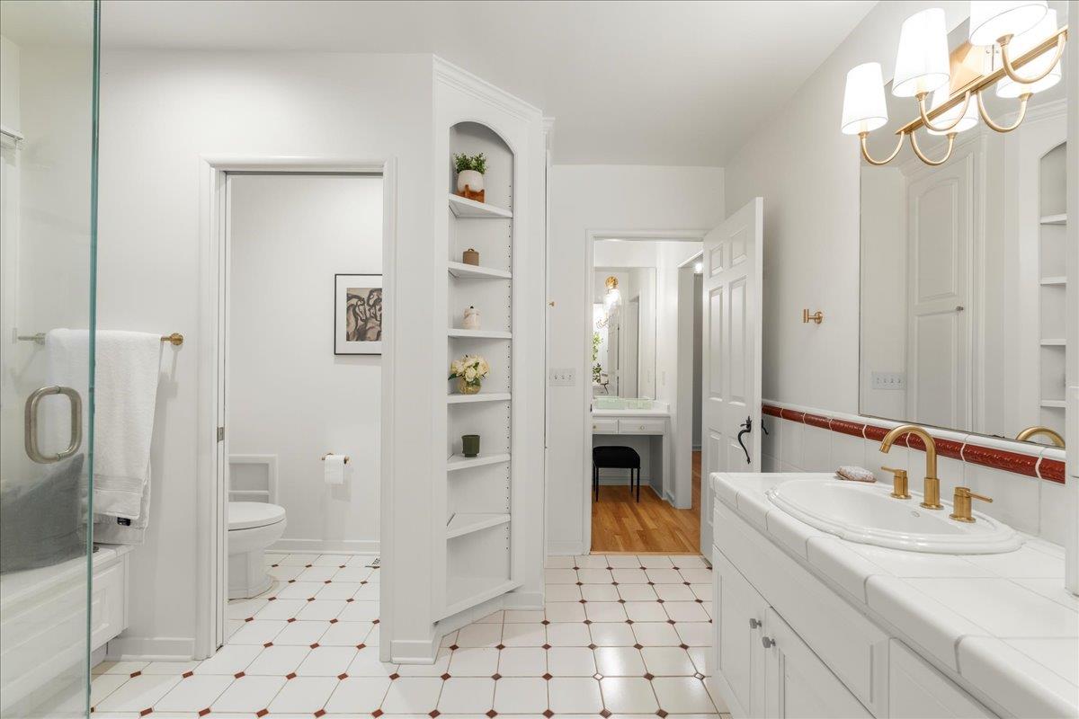 1042 Camino Ramon San Jose, CA 95125 - Photo 25 of 54 a bathroom with a sink a toilet and shower