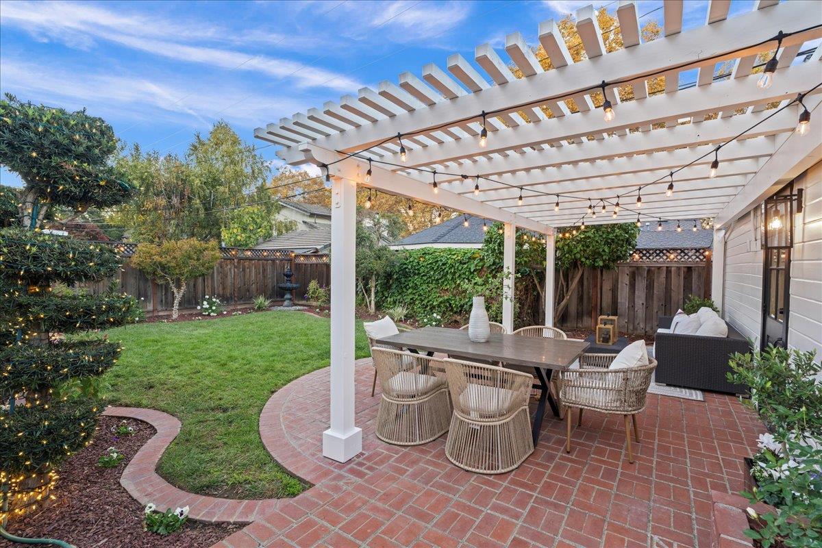 1042 Camino Ramon San Jose, CA 95125 - Photo 27 of 54 a view of a patio with table and chairs potted plants and large tree