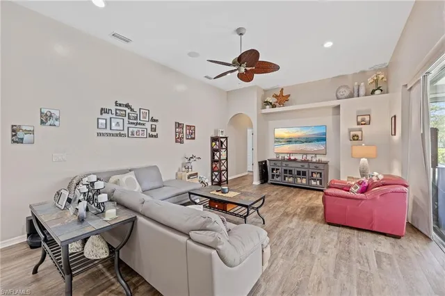a living room with furniture and white walls