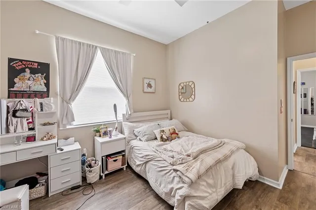 a bedroom with a bed and a desk