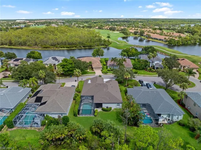 an aerial view of a house with a lake view