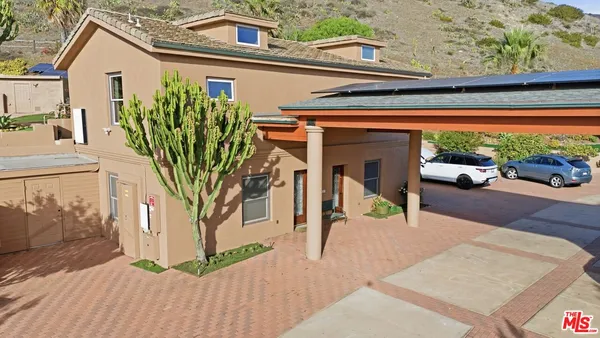 a view of a house with a small garden