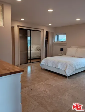 a kitchen with granite countertop a sink and cabinets