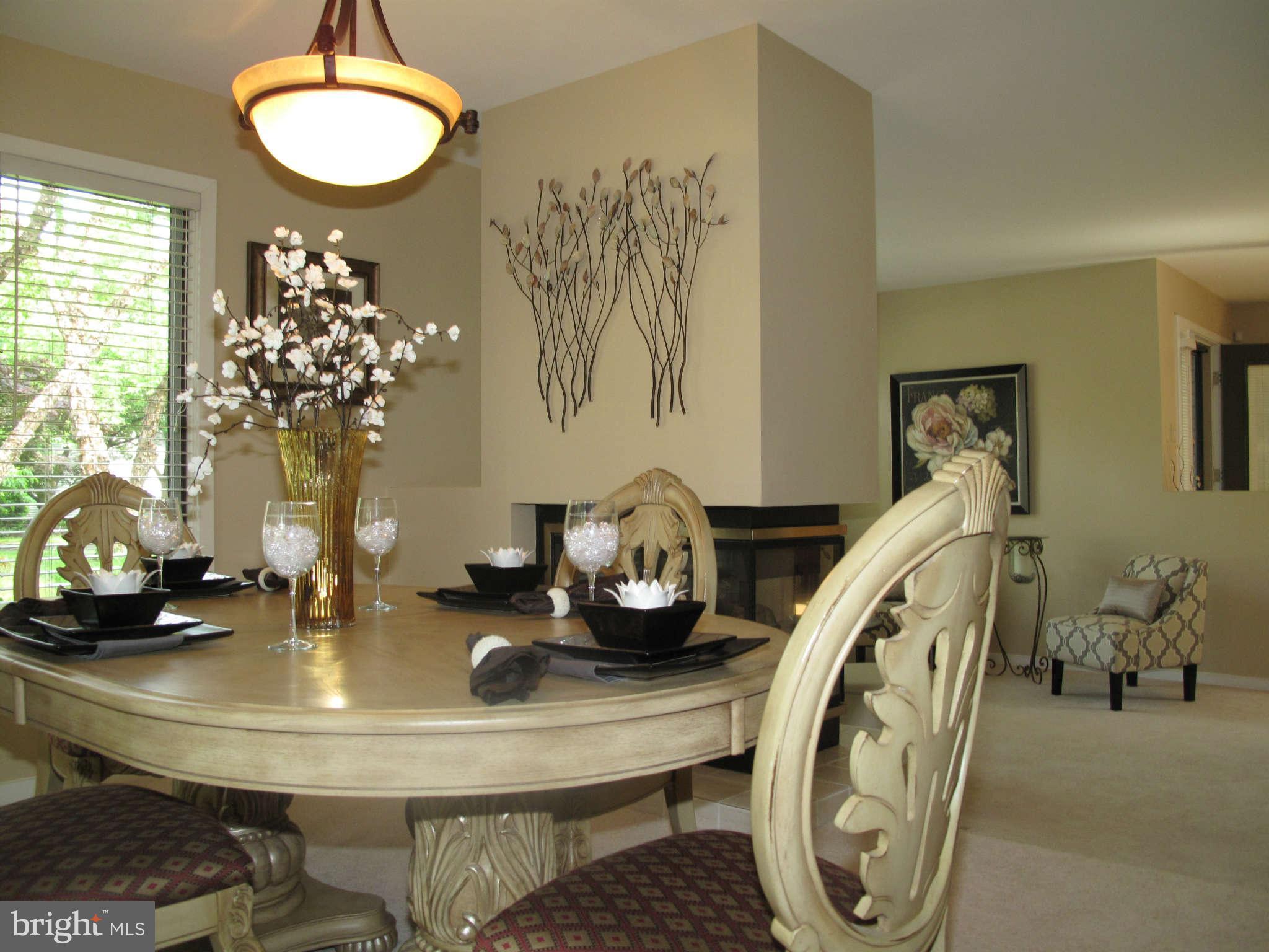 12009 North Walnut Branch Road Reston, VA 20194 - Photo 5 of 28 Dining Room with 3 sided fireplace