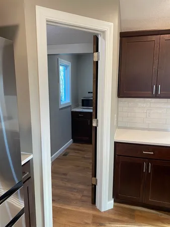a view of a kitchen from the hallway