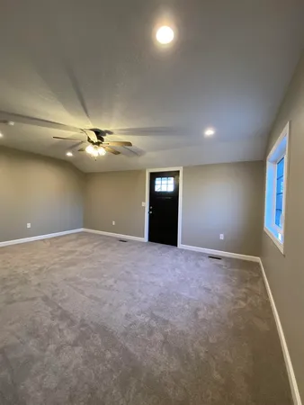a view of an empty room with a window