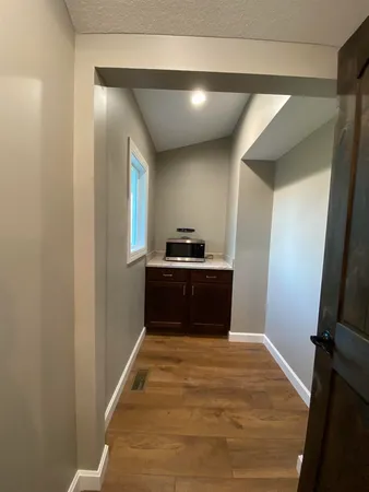 a bedroom with a bed and a mirror