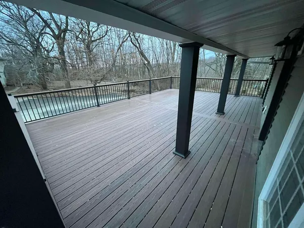 a view of balcony with wooden floor