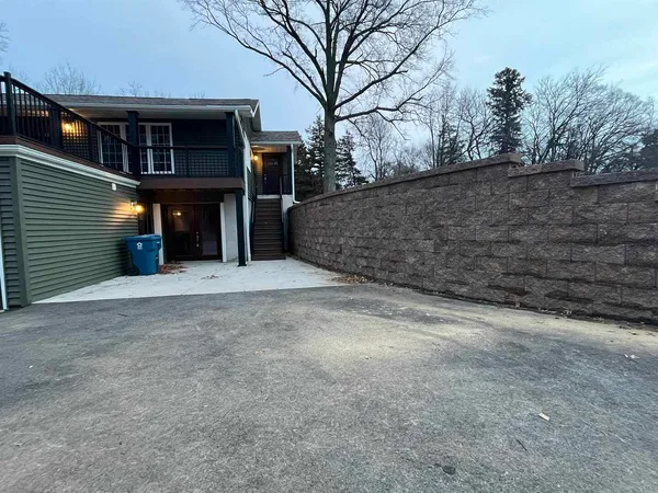 a view of a house with a tree