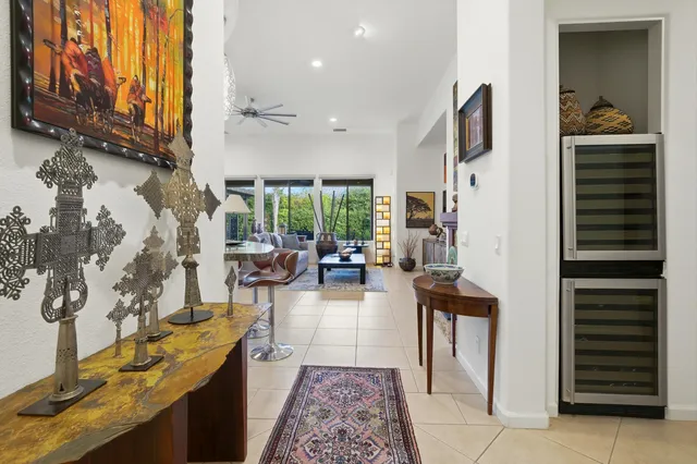 a living room with fireplace furniture and a flat screen tv