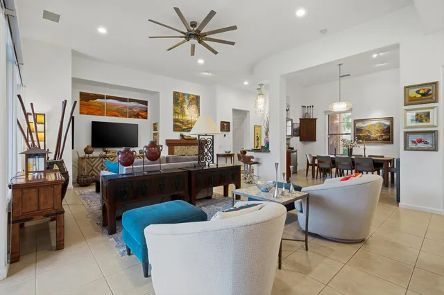 a living room with fireplace furniture and a flat screen tv