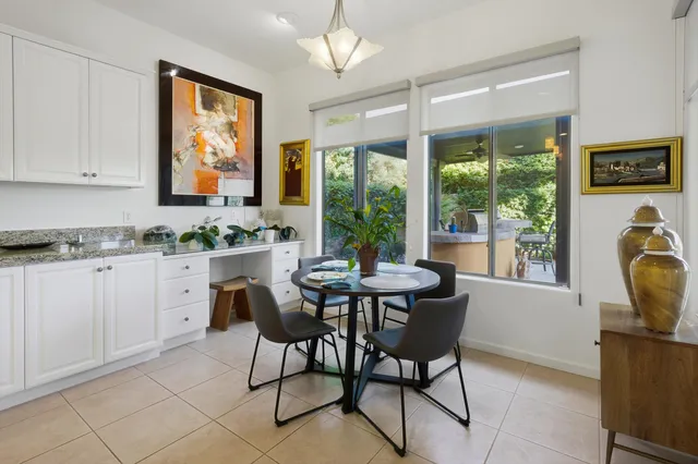 a view of a dining room with furniture window and outside view
