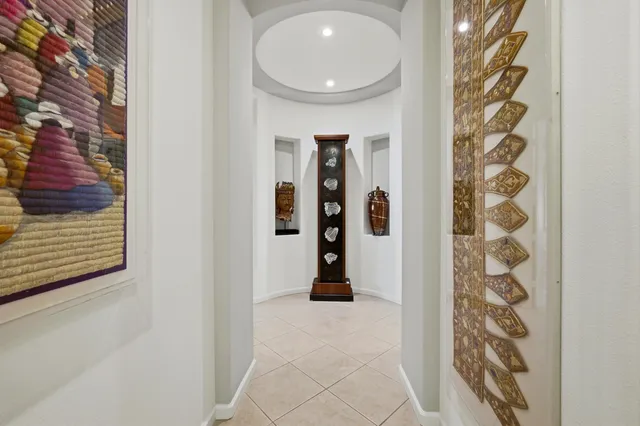 a bathroom with a toilet and shower curtain