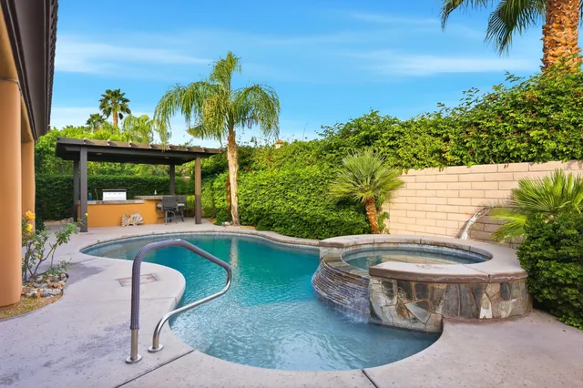 a view of a swimming pool with a patio