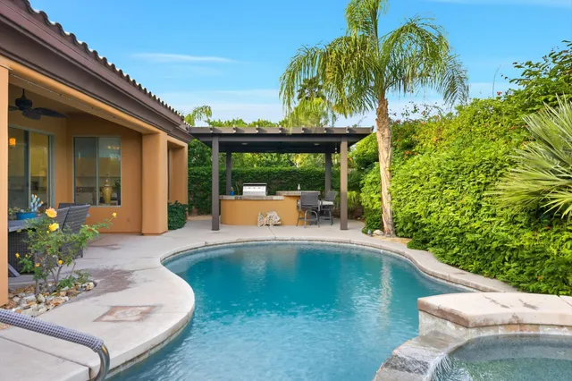 a view of a swimming pool with a patio