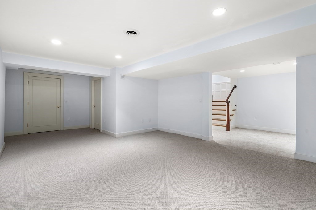 102 Byron Road Weston, MA 02493 - Photo 32 of 39 an empty room with staircase and white walls