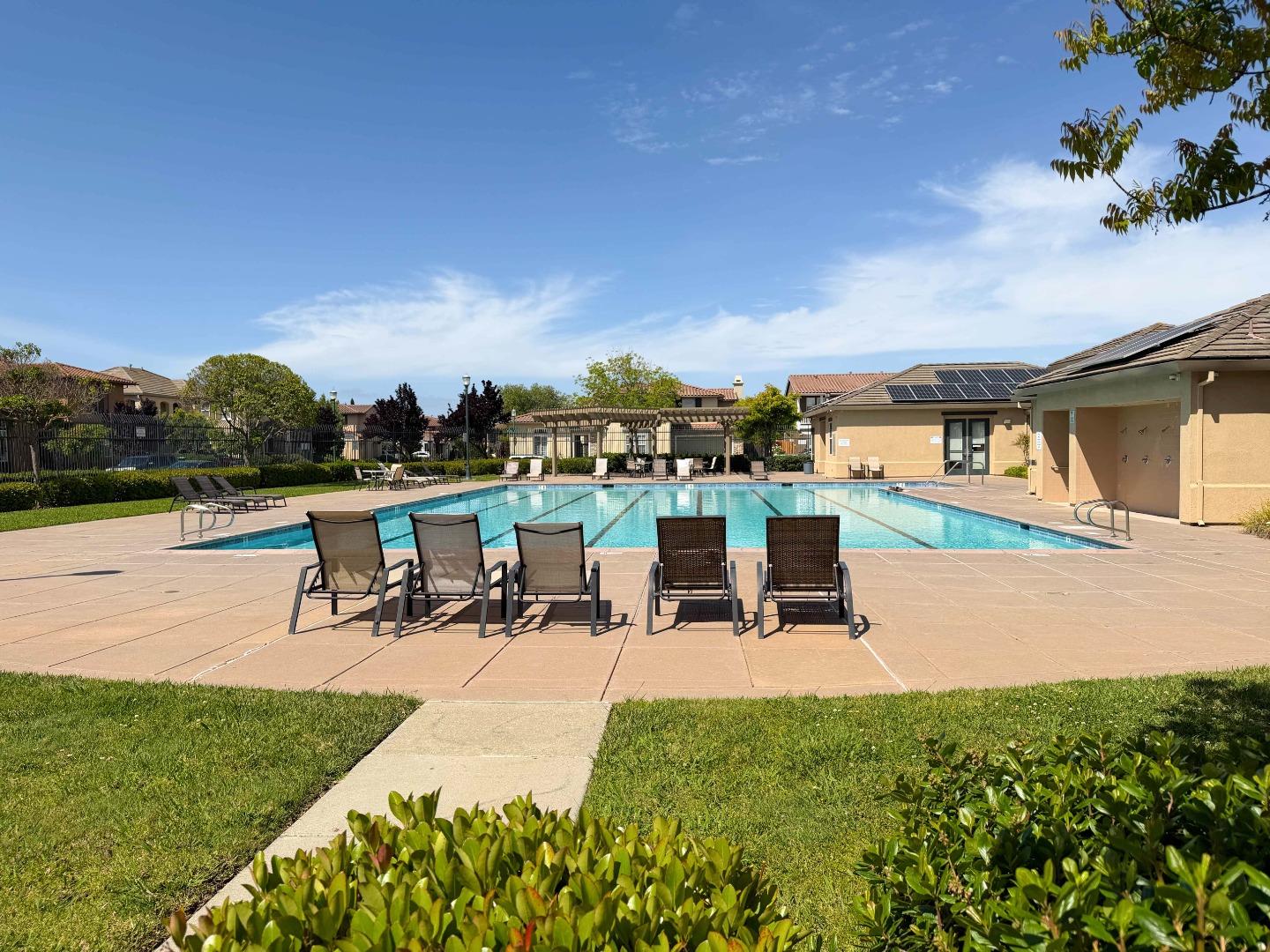 2715 Shellgate Circle Hayward, CA 94545 - Photo 41 of 47 a view of a swimming pool with lawn chairs and a fire pit
