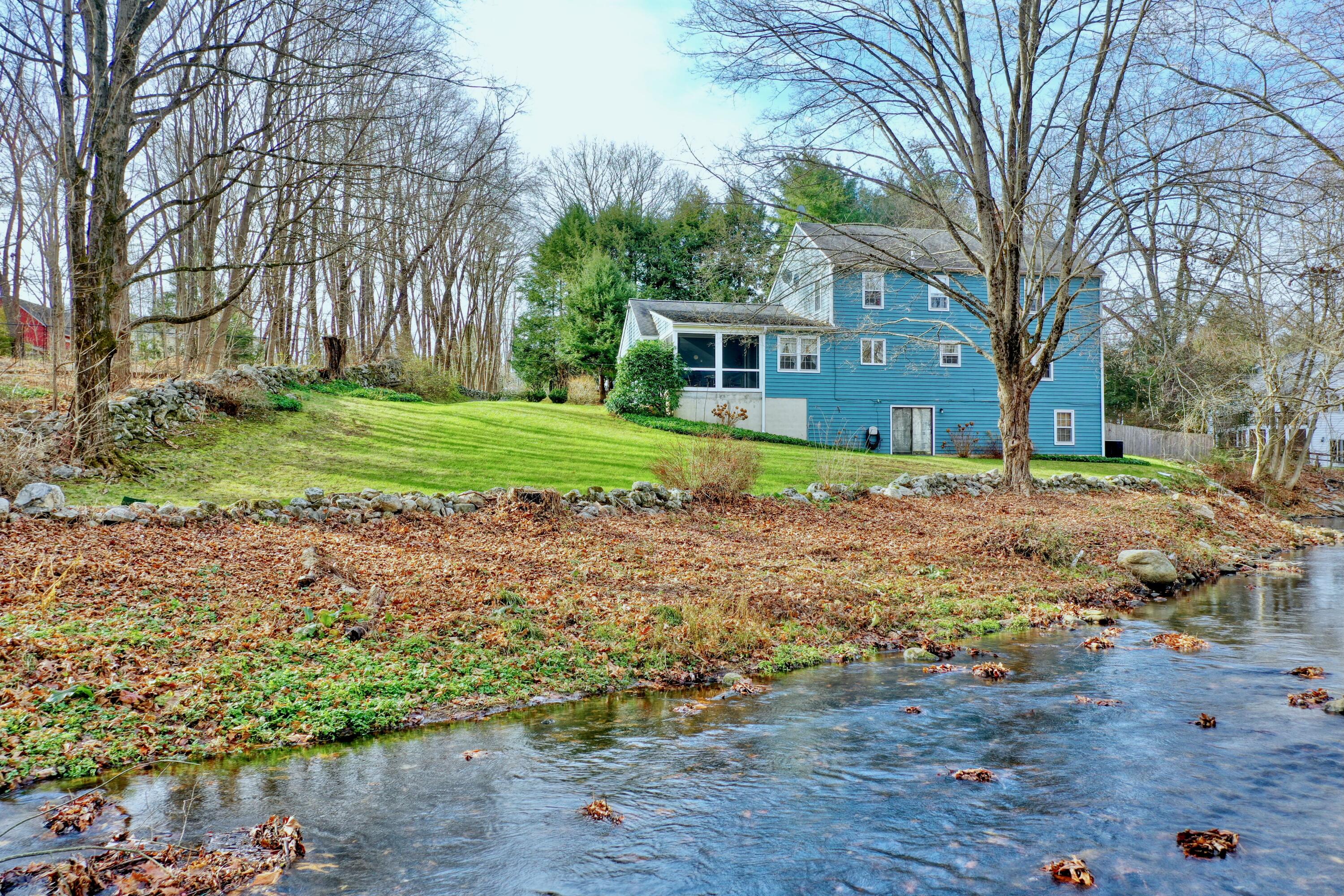 24 White Oak Shade Road New Canaan, CT 06840 - Photo 13 of 13 a view of a house with a yard