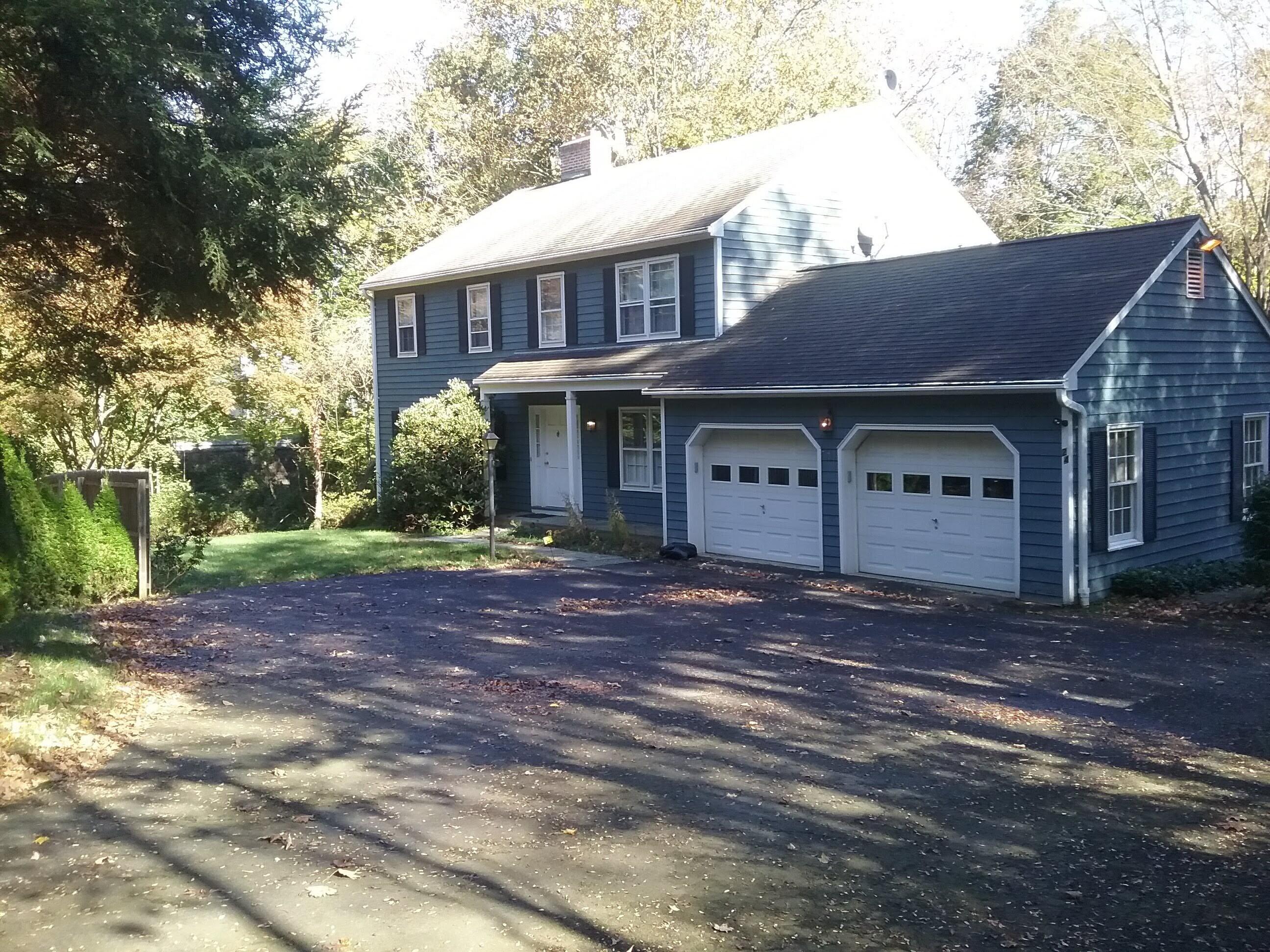 24 White Oak Shade Road New Canaan, CT 06840 - Photo 4 of 13 a view of a house with a yard