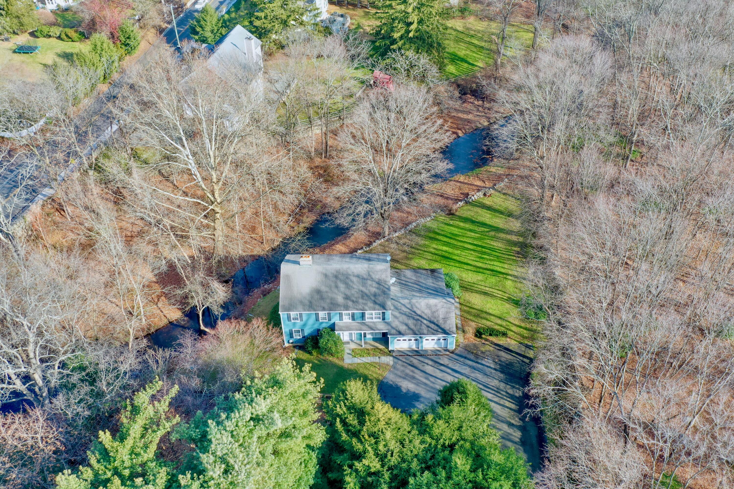 24 White Oak Shade Road New Canaan, CT 06840 - Photo 9 of 13 a view of a yard with plants