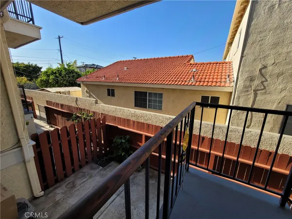 a view of a house with wooden deck