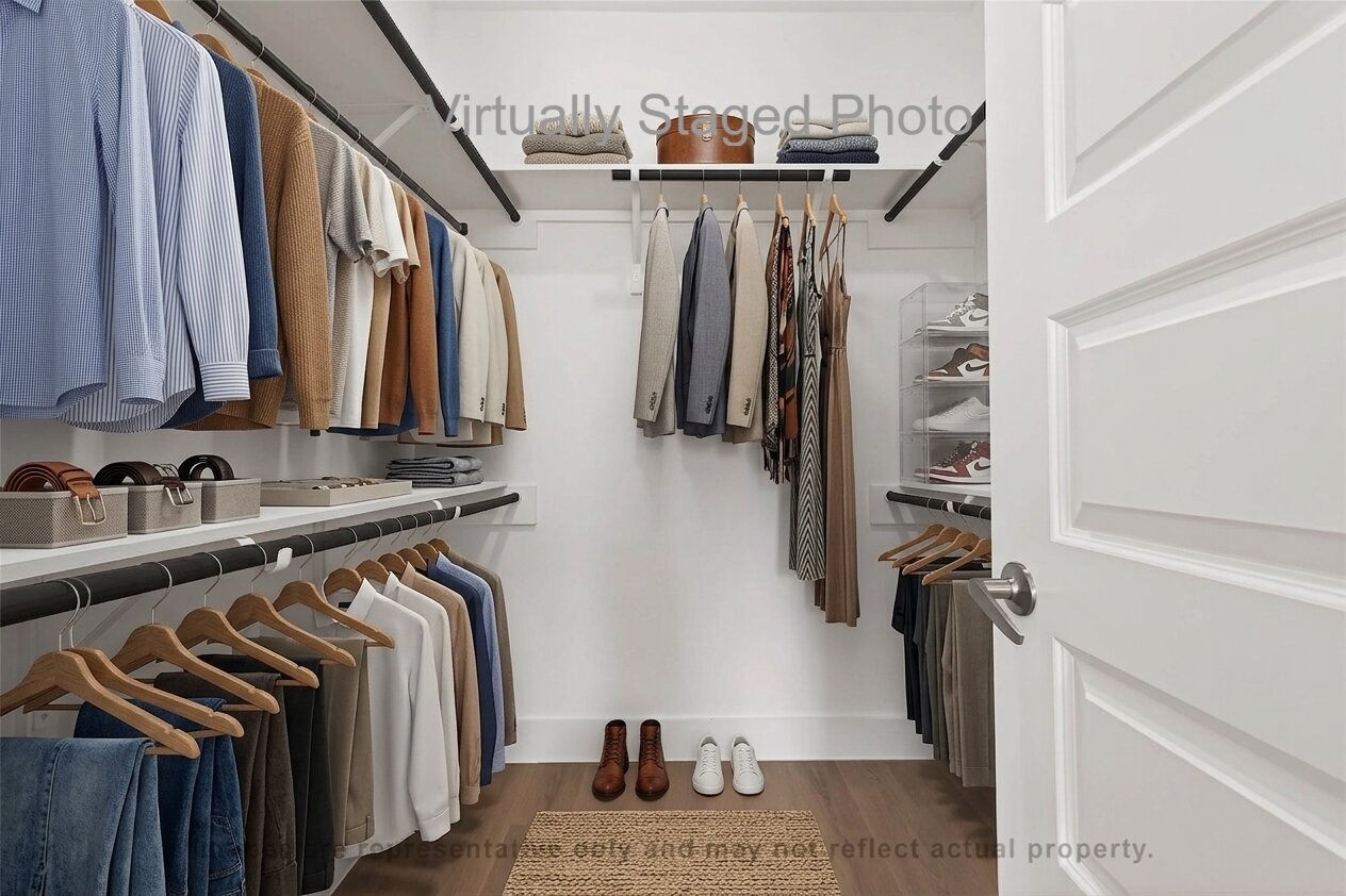 10719 Mason Road, Unit 15 Richmond, TX 77406 - Photo 18 of 50 Virtual Staging - Well-lit walk-in closet featuring structured clothing racks, neatly folded items, and built-in shelving for shoes and accessories