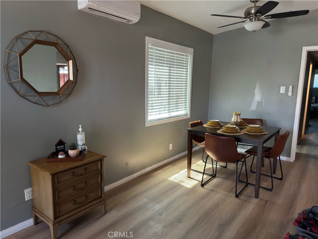 1735 Chestnut Avenue Long Beach, CA 90813 - Photo 3 of 13 a view of a workspace with furniture and a wooden floor