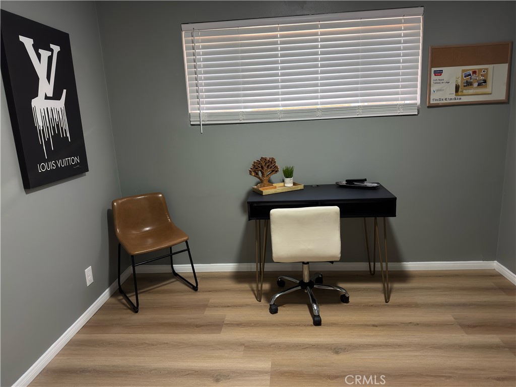 1735 Chestnut Avenue Long Beach, CA 90813 - Photo 4 of 13 a view of a workspace with furniture and a window