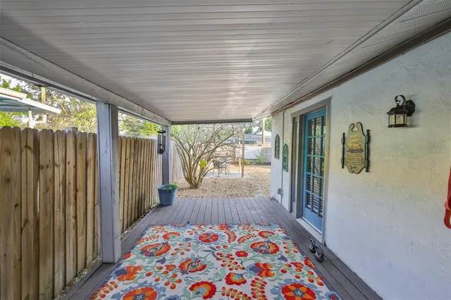 an aerial view of a house with yard swimming pool and outdoor seating